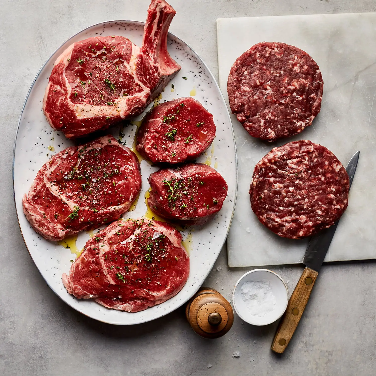 Deering Farms LLC premium freezer beef displayed on a wooden table, highlighting gourmet, locally sourced farm products.